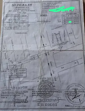 Vente d'un terrain à Davié, parcelle clôturée avec pièce et magasin, proche du goudron – 15 millions FCFA — photo 2