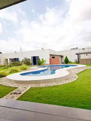 Vente d'une villa à Agoè Legbassito, 7 chambres, 1958 m², avec piscine et jardin, titre foncier personnel – 400 millions FCFA — photo 8