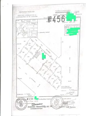 Vente de terrain à Agoè 2 Lions, 2 lots clôturés, titre foncier global – 65 millions FCFA le lot — photo 1