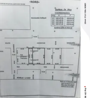 Terrain 399 m² avec bâtiment en construction à vendre à Agoè Zossimé – 30 millions FCFA