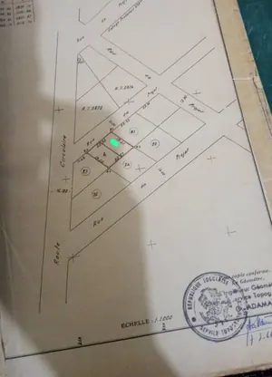 Vente d'une maison à Tokoin Hôpital Kodome, 4 chambres salon, demi-lot, titre foncier personnel – 25 millions FCFA