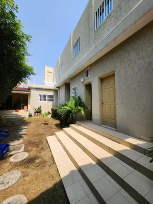 Maison duplex 6 chambres en vente en angle de rue à Baguida – 180 millions FCFA