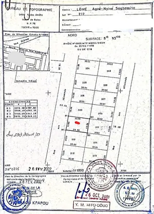 Terrain 595 m² avec 4 boutiques en vente en bordure de voie à Agoè Anonkui – 45 millions FCFA
