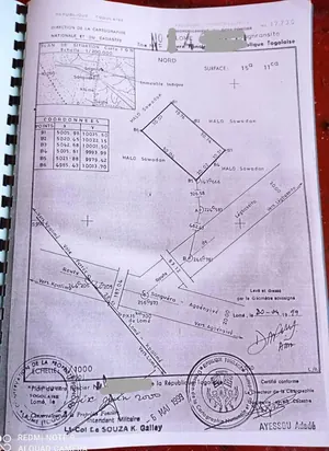 Vente d'un terrain à Zanguéra Sanyramé, 2,5 lots clôturés – 40 millions FCFA