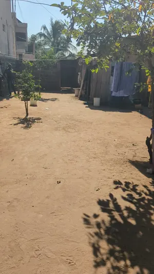 Vente d'un terrain à Nanégbé, demi-lot (30/10), 2 pièces, clôturé, proche du goudron – 19 millions FCFA à débattre — photo 5