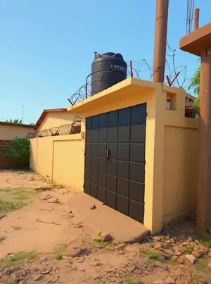 Vente d'une villa à Zanguéra-Klikamé, 2 chambres, 1/4 de lot, titre foncier en cours – 15 millions FCFA